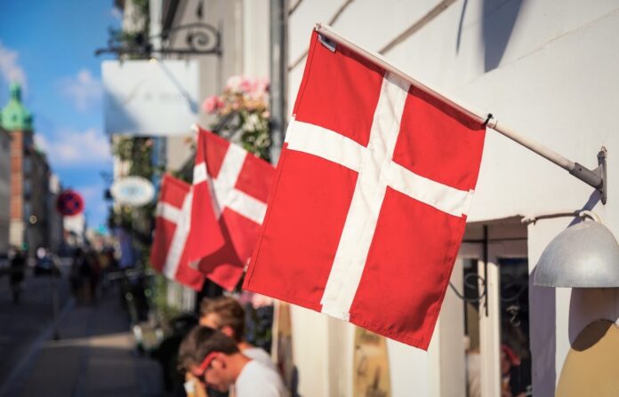 Copenhagen,Iconic,View.,Denmark,Flags,Near,Nyhavn,Canal,On,Medieval